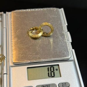 1.8 GRAM OF 18 KARAT VERSACE GOLD EARRING