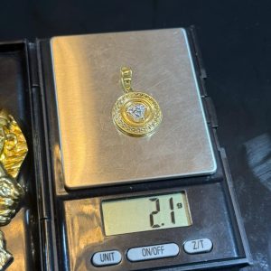 2.1 GRAMS 0F 18KARAT VERSACE PENDANT